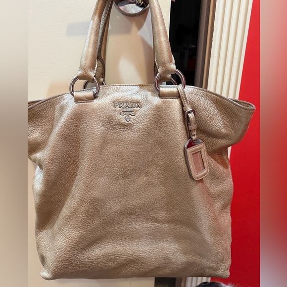 Prada Handbags - Prada tote bag with detachable crossbody strap in gold leather.